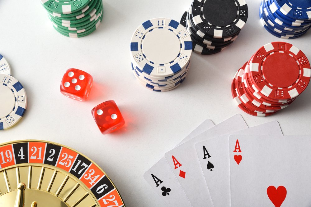Background with casino game objects isolated on white table